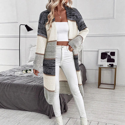 Grey loose-fit women's knitted cardigan with long sleeves and a striped plaid pattern.