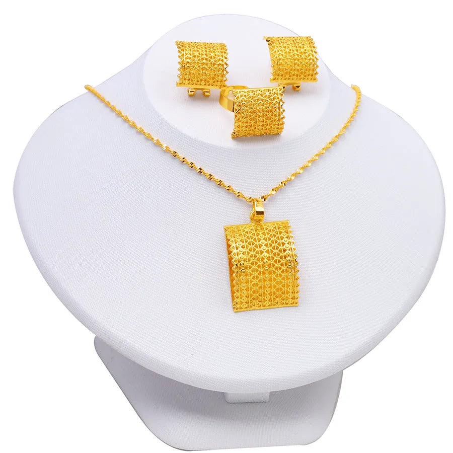Golden women's bridal jewellery set showing copper necklace, earrings, and ring.