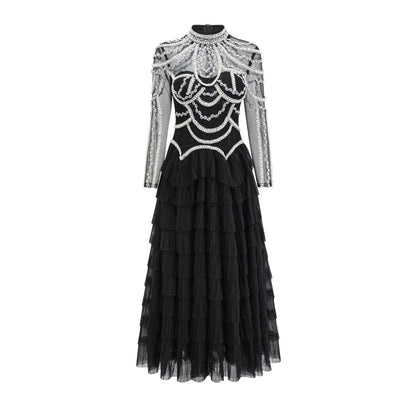 Black long sleeve beaded dress for women with 3D decoration and mid-waist fit.