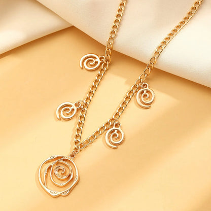 Gold spiral donut alloy jewellery set showing adjustable necklace, matching bracelet, and ear hooks on a plain background.