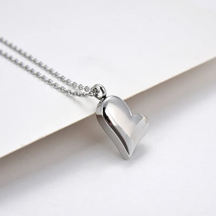 Silver curved 23mm peach heart pendant stainless steel necklace with 51cm + 5cm adjustable chain