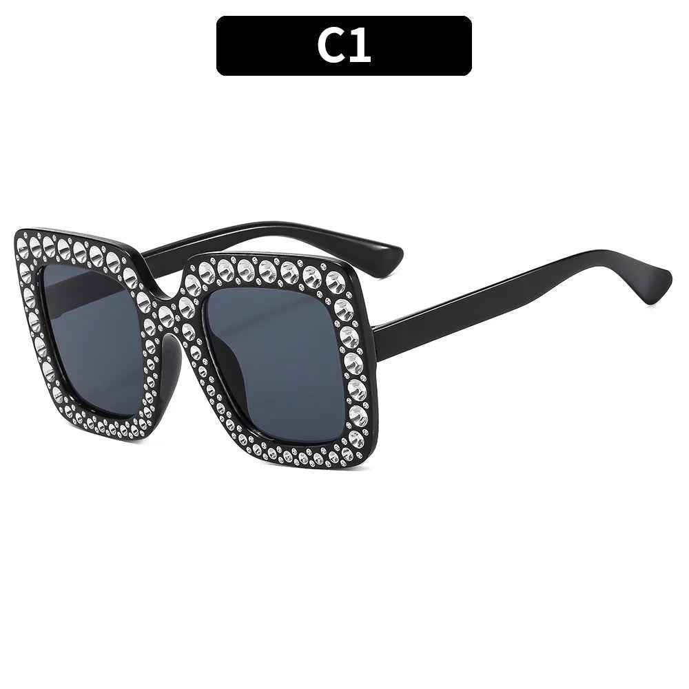 Plastic sunglasses with fashion personality styling in various colour options including black frame and transparent tea frame