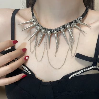Women's casual leather necklace with winding round beads, a tassel, and decorative point rivets in pictured colour.