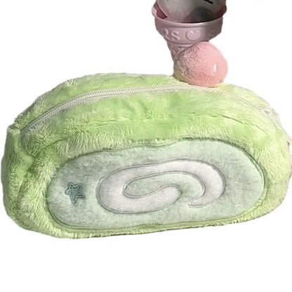 Honeydew Roll Plush velvet pencil case with Swiss roll cake design, showing roll-up style and soft texture for stationery storage.