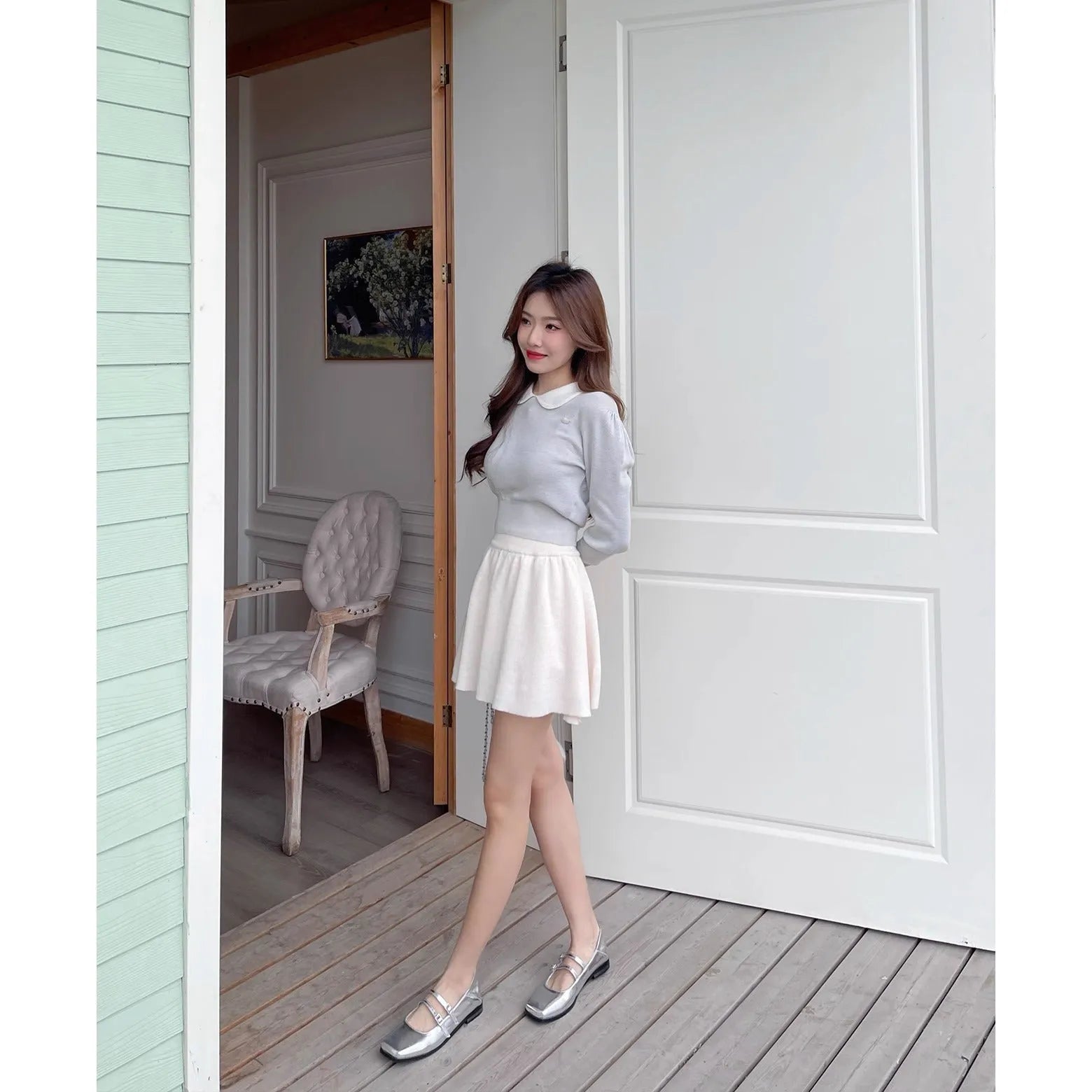 Women's silver genuine sheepskin Mary Jane ballet flats with an adjustable cross-buckle strap on the instep.