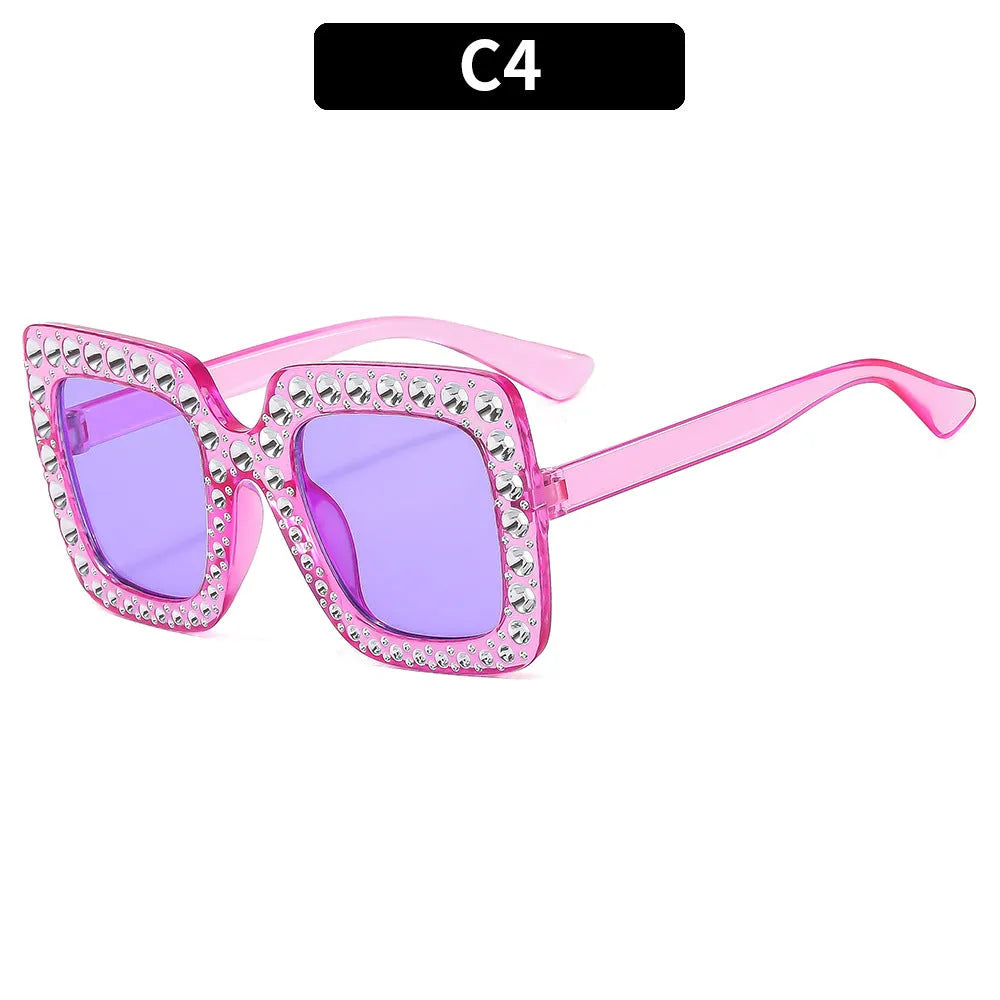 Plastic sunglasses with fashion personality styling in various colour options including black frame and transparent tea frame
