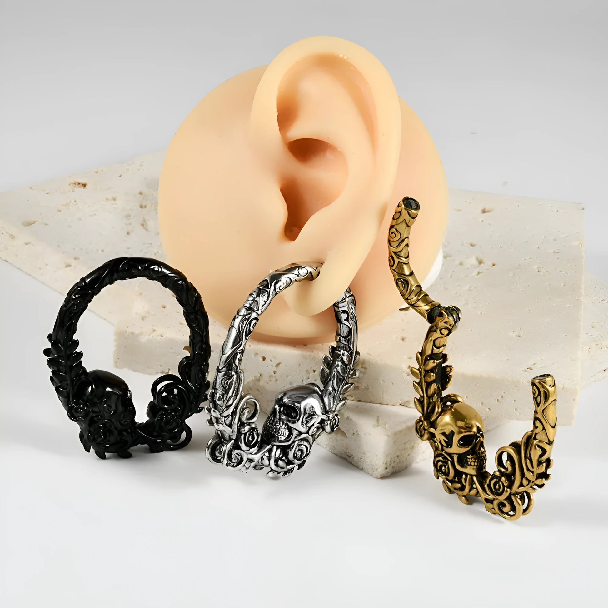 Stainless steel totem pattern earrings in electroplated finishes, showing one of fifteen style variations.
