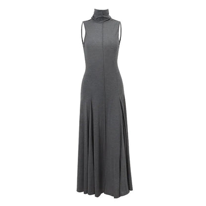 Grey slim-fit cotton dress with a half turtleneck and backless design on a mannequin.