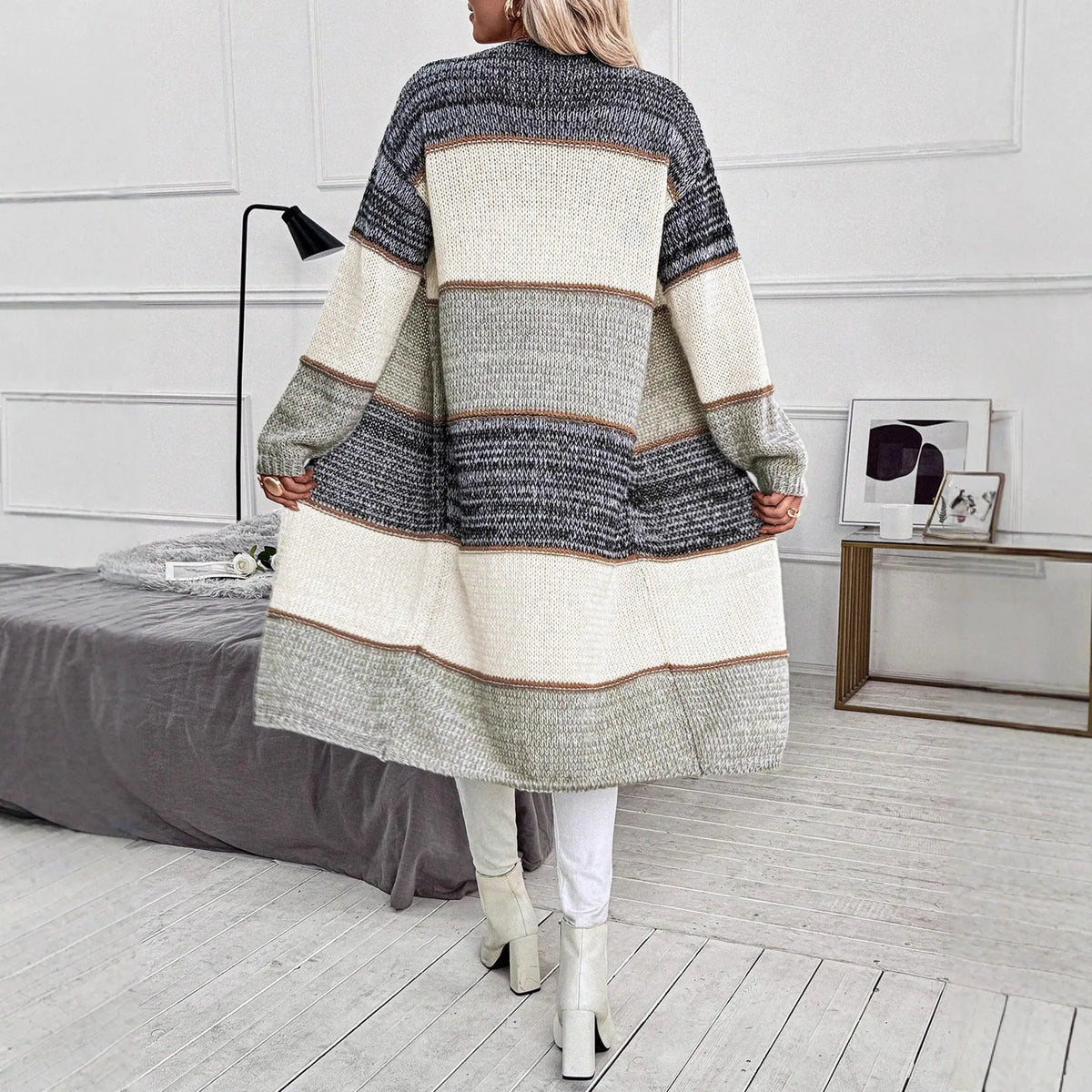 Grey loose-fit women's knitted cardigan with long sleeves and a striped plaid pattern.