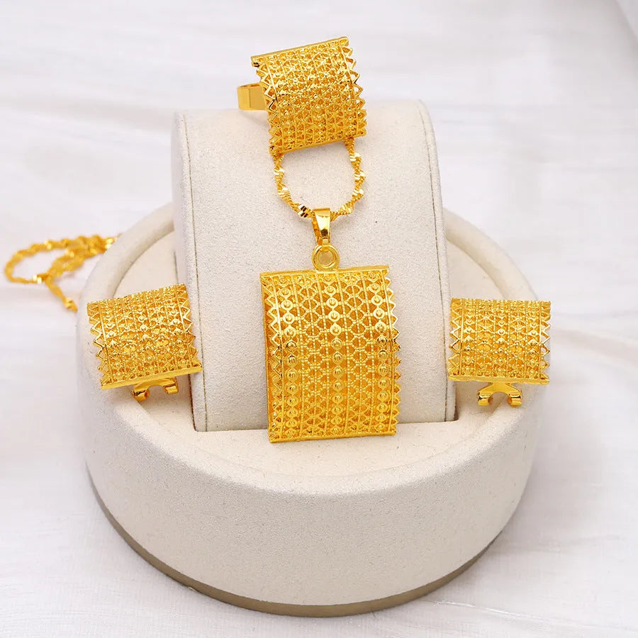 Golden women's bridal jewellery set showing copper necklace, earrings, and ring.