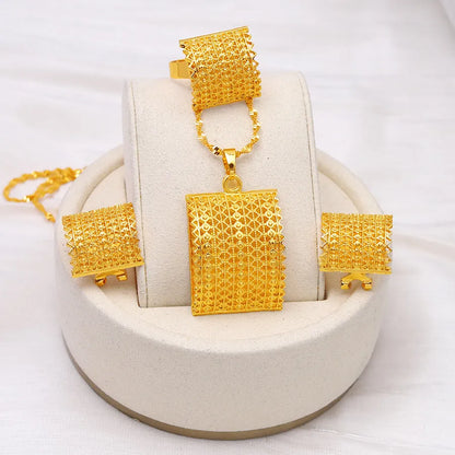 Golden women's bridal jewellery set showing copper necklace, earrings, and ring.