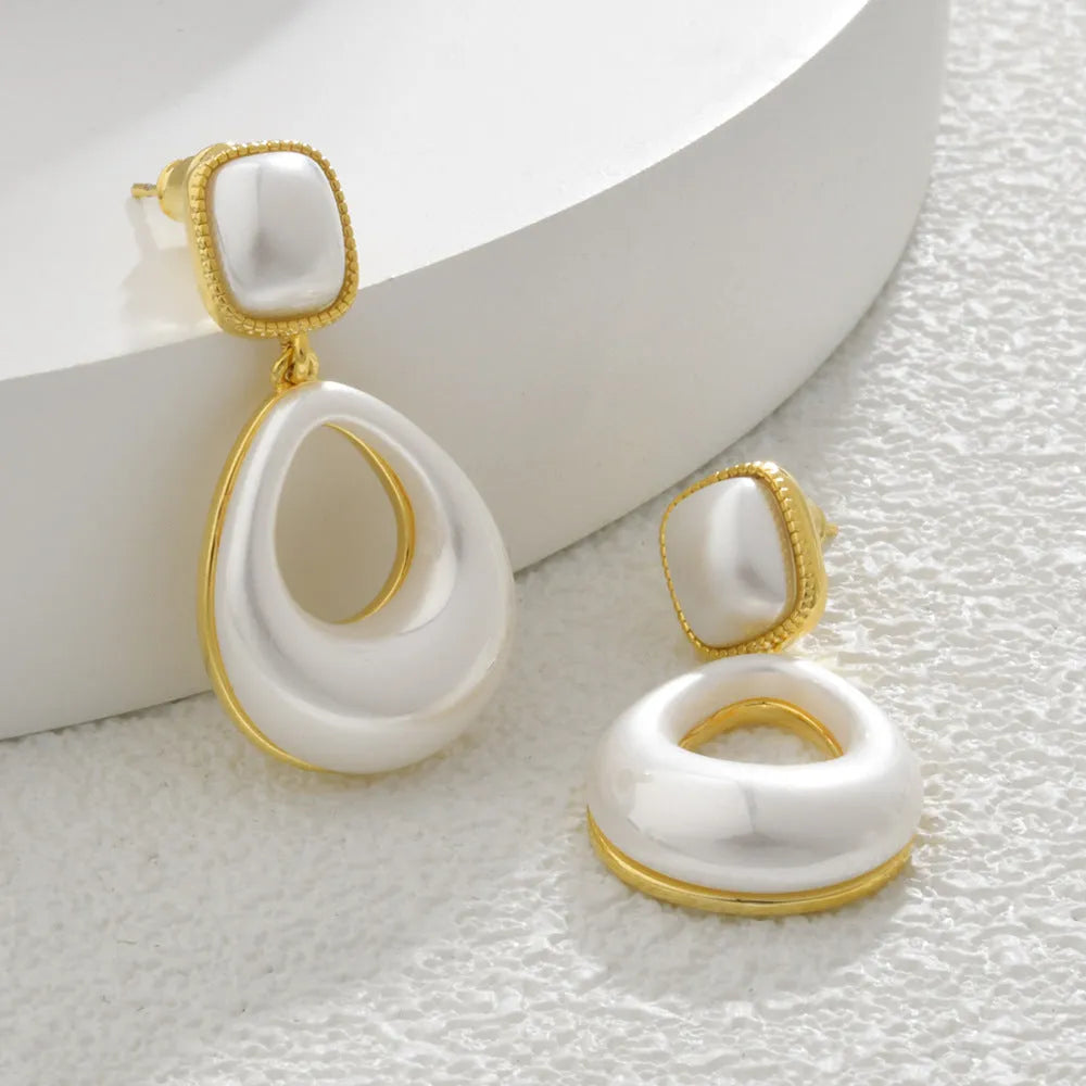 Gold drop earrings with imitation mabe pearl component and 14K gold plating
