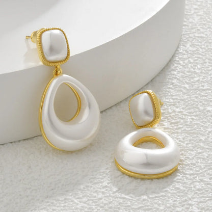 Gold drop earrings with imitation mabe pearl component and 14K gold plating