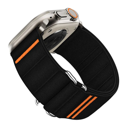 Elastic nylon Apple Watch band with stainless steel buckle shown in Army Green colour on a wrist.