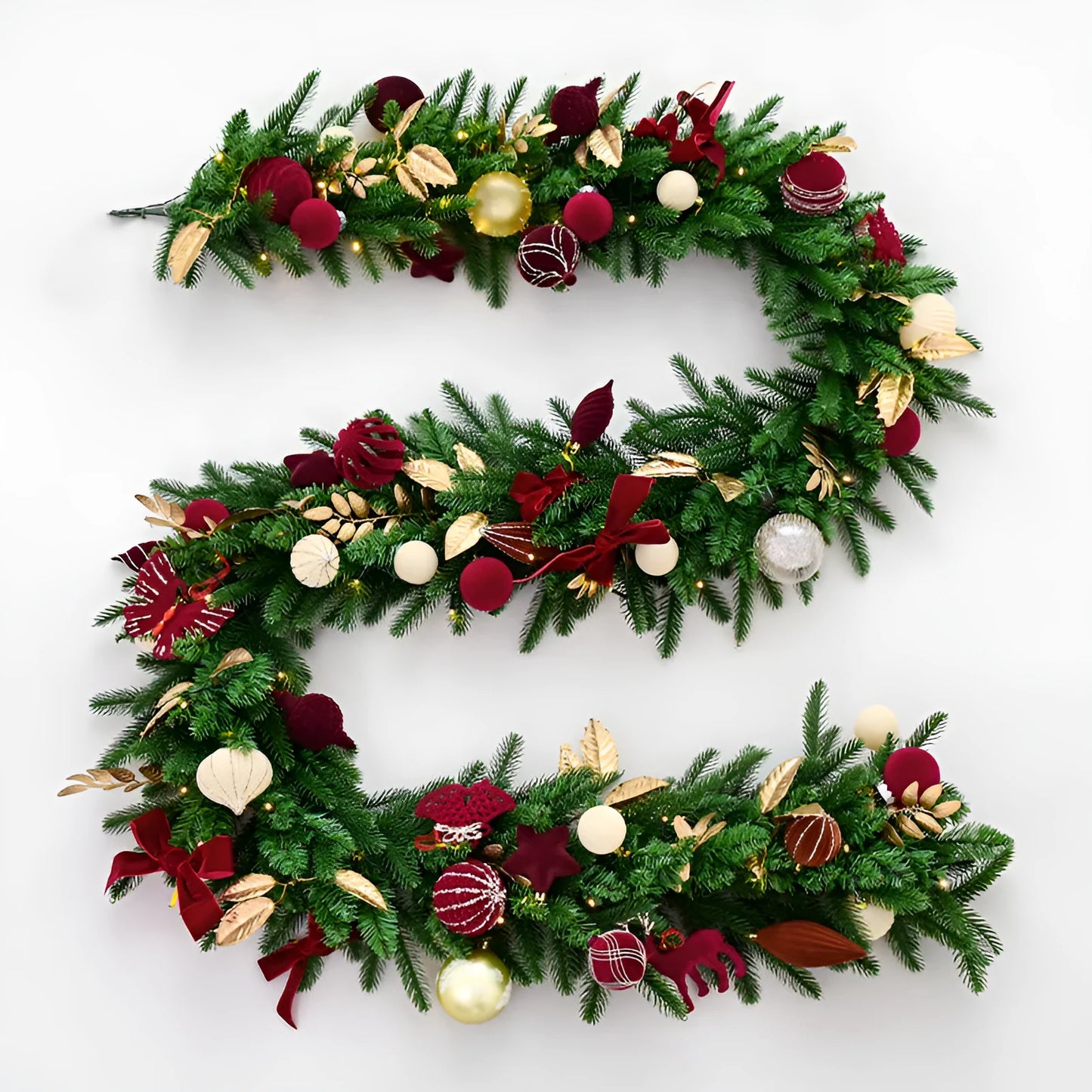Long 2.7 metre Christmas PE rattan garland with velvet balls and integrated lights in golden leaf or red rattan colour.
