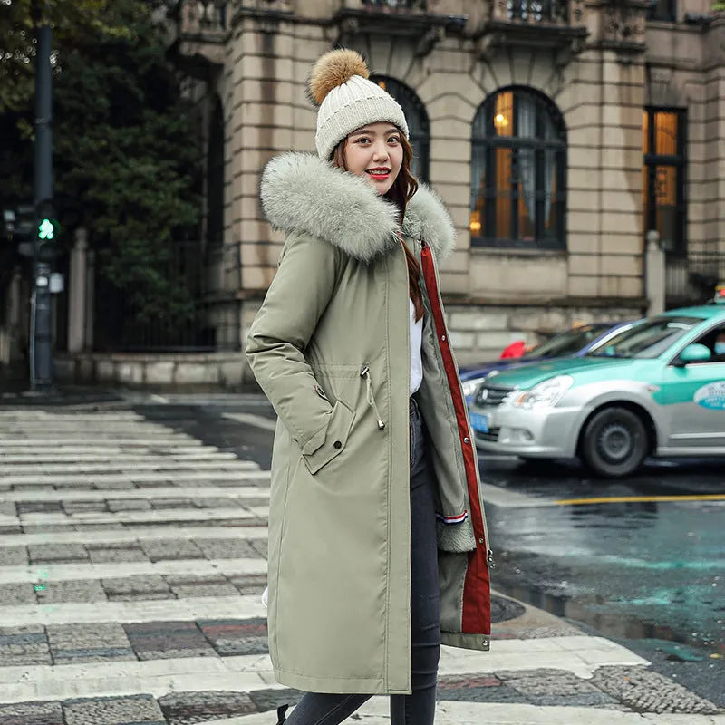 Women's long padded beige trench coat with a fleece lining, shown on a model.