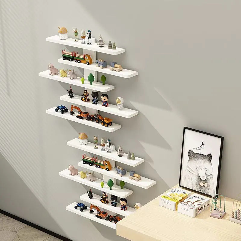 White 5-tier wall-mounted PVC rack displaying toy dolls and blind box collectibles.