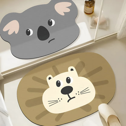 Alien-shaped diatomaceous earth bathroom mat with a cartoon hippo design on a tiled floor.