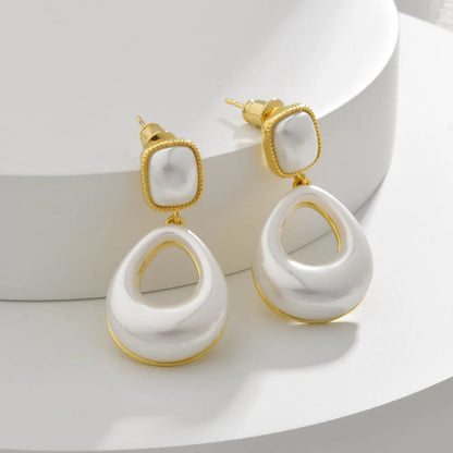 Gold drop earrings with imitation mabe pearl component and 14K gold plating