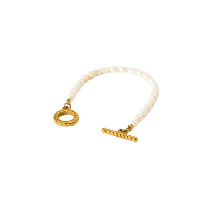 Freshwater pearl and stainless steel geometric pendant necklace with matching bracelet set.