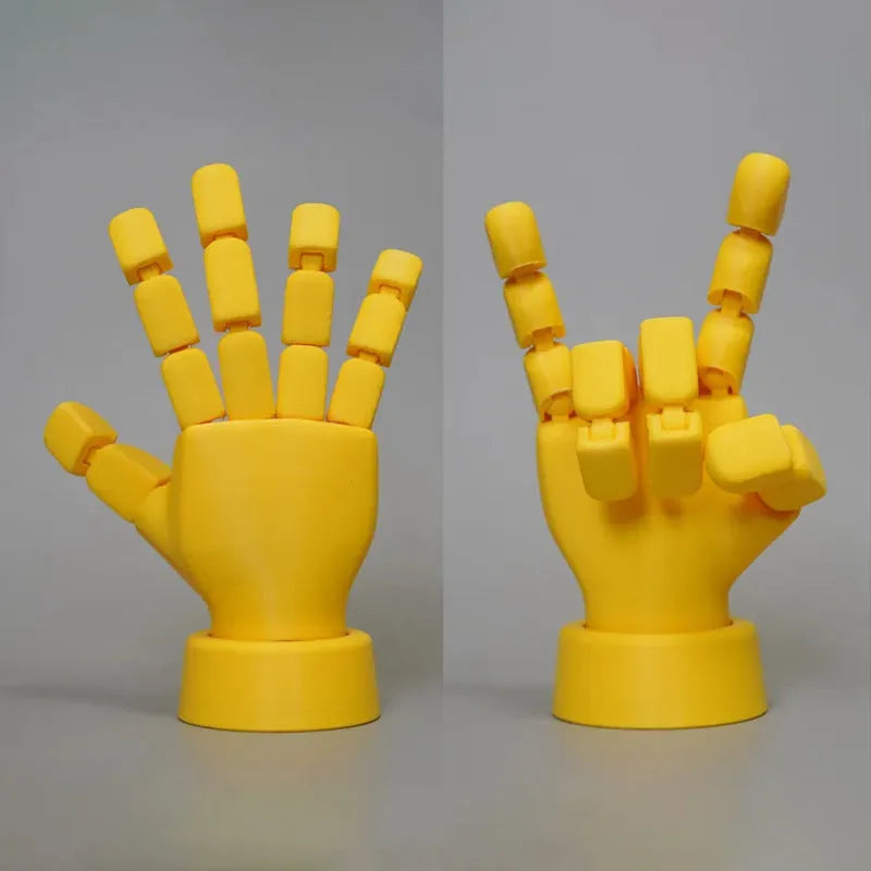 Yellow movable joint hand ornament showing articulated design and 5*5.38*7.5cm dimensions
