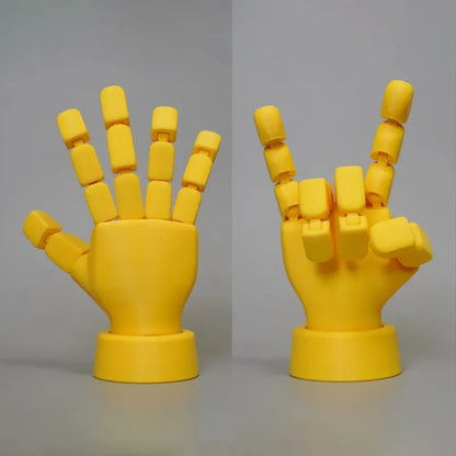 Yellow movable joint hand ornament showing articulated design and 5*5.38*7.5cm dimensions