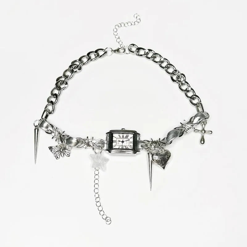 Dark women's layered necklace with twin chains, a cross pendant, and textured hemp-style links.