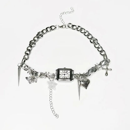 Dark women's layered necklace with twin chains, a cross pendant, and textured hemp-style links.