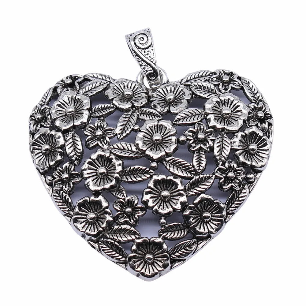 Hollow floral love pendant in ancient silver finish with European American styling