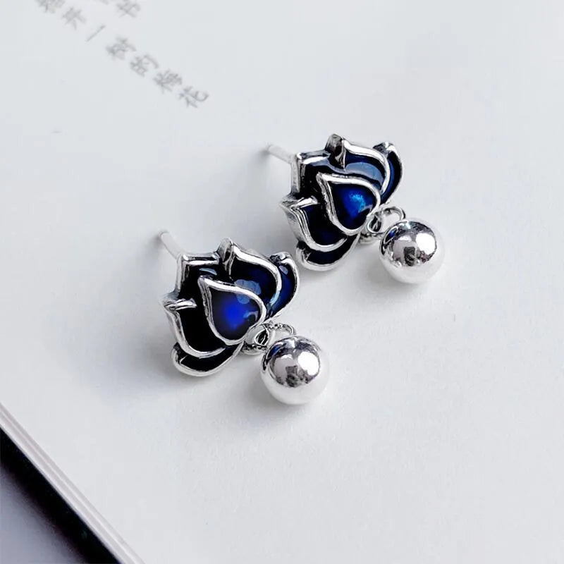 Blue lotus earrings with retro artistic seedpod tassel design, 1.2cm wide alloy studs
