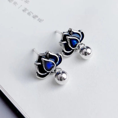 Blue lotus earrings with retro artistic seedpod tassel design, 1.2cm wide alloy studs