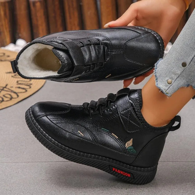 Women's non-slip cotton velvet indoor shoes with a rubber sole, available in UK sizes 4-9, featuring a low tube sock design and hollow out detailing for a comfortable, warm slipper option in black or red.