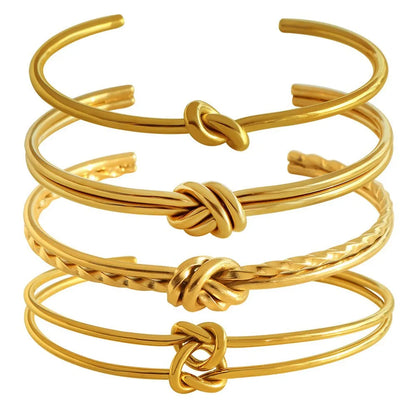 Stainless steel women's bracelet with knotted C-shape open double-layer design in gold or silver.