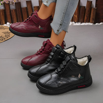 Women's black velvet indoor shoes with a non-slip rubber sole and low tube sock design.