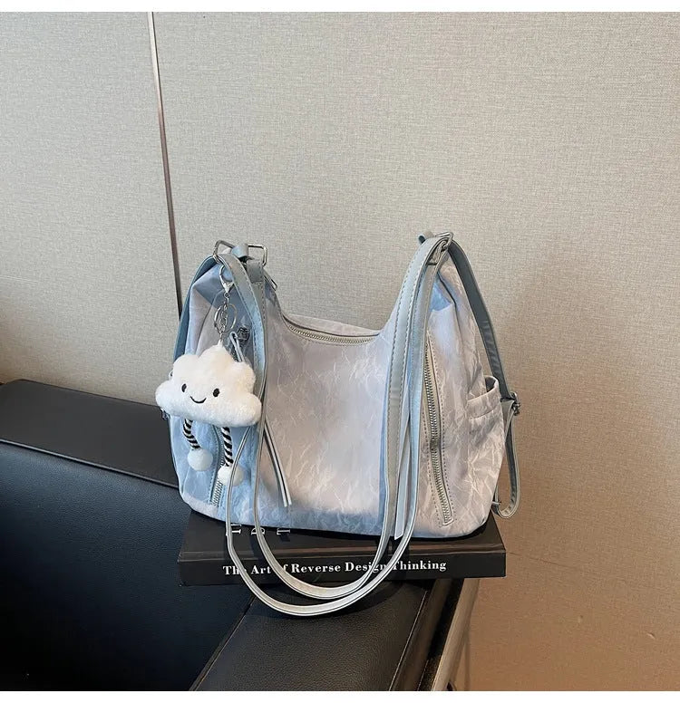 Women's soft PU backpack shoulder bag with pendant accessory in multiple colour options