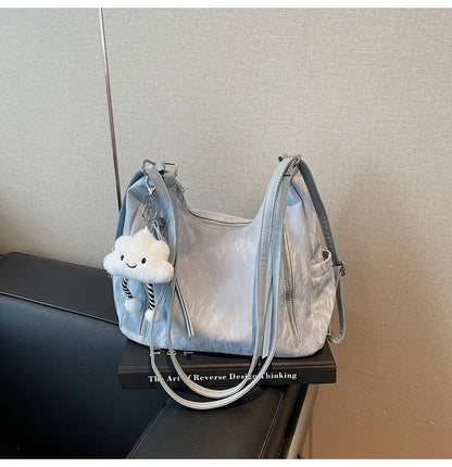 Women's soft PU backpack shoulder bag with pendant accessory in multiple colour options