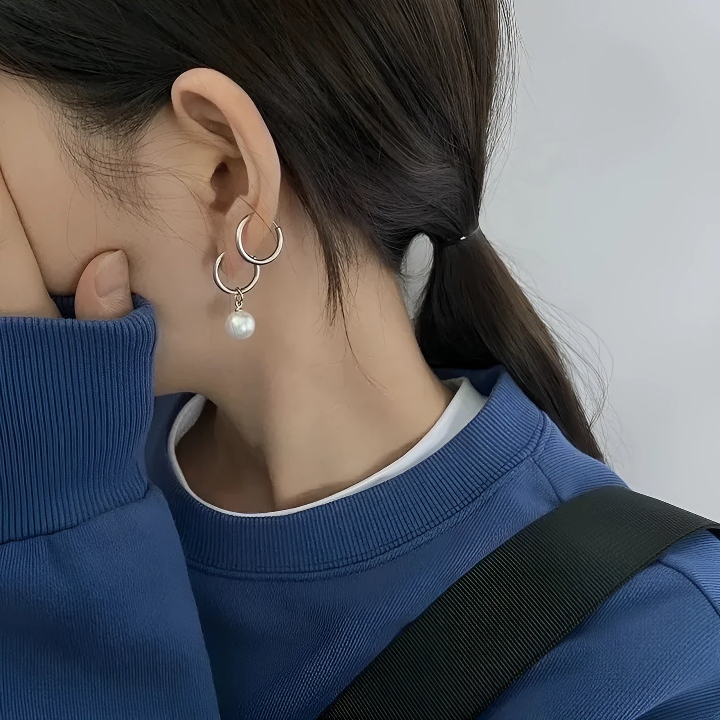 Women's geometric pearl drop earrings with titanium steel posts and round design elements