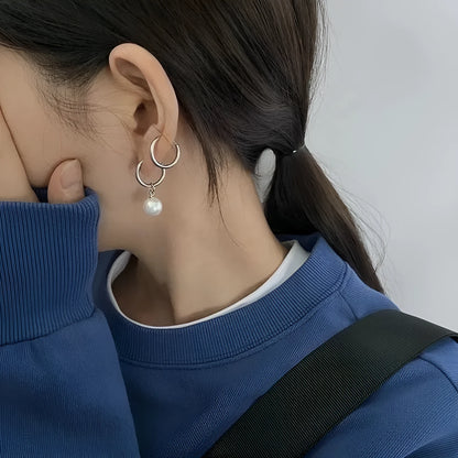 Women's geometric pearl drop earrings with titanium steel posts and round design elements