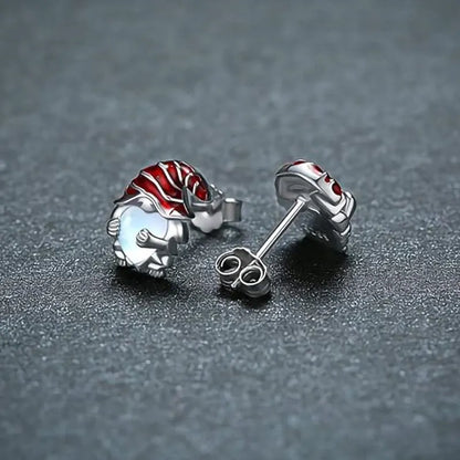 Santa Claus heart-shaped earrings in white gold colour on copper background