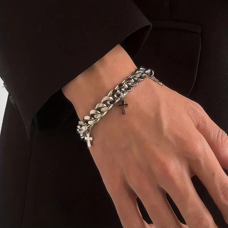 Men's titanium steel bracelet with a geometric cross design on a wrist.