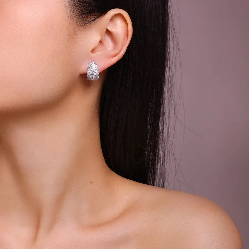 Geometric sterling silver ear studs with moissanite stones in gift box