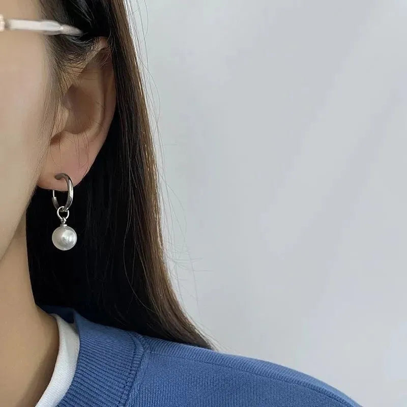 Women's geometric pearl drop earrings with titanium steel posts and round design elements