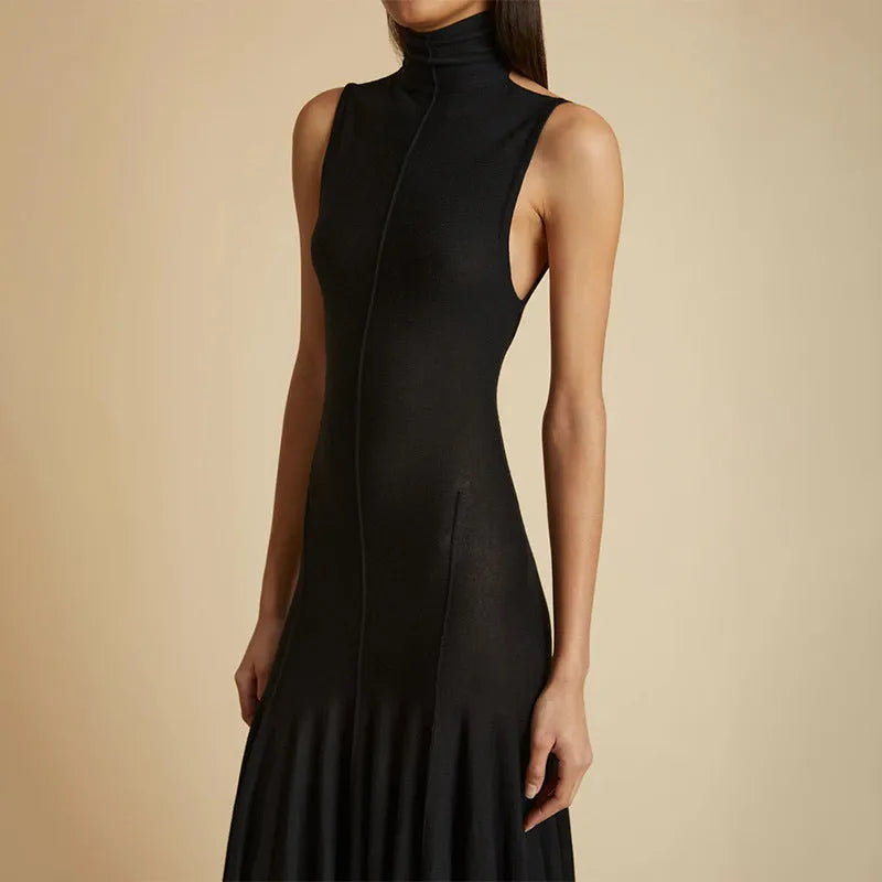 Grey slim-fit cotton dress with a half turtleneck and backless design on a mannequin.