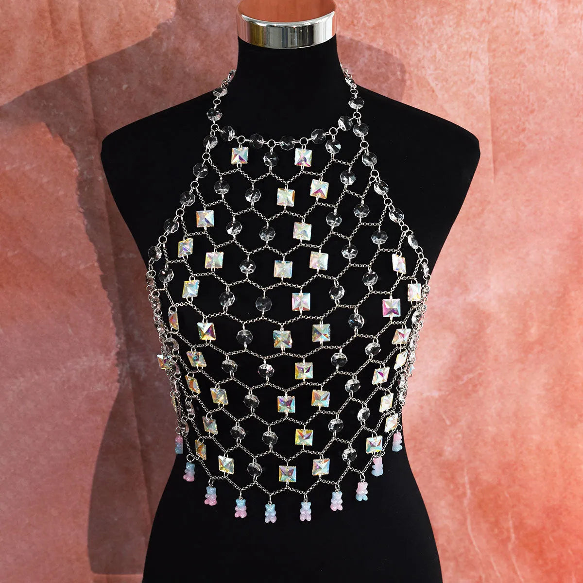 Clear acrylic crystal sequins body chain draped as a chest necklace.