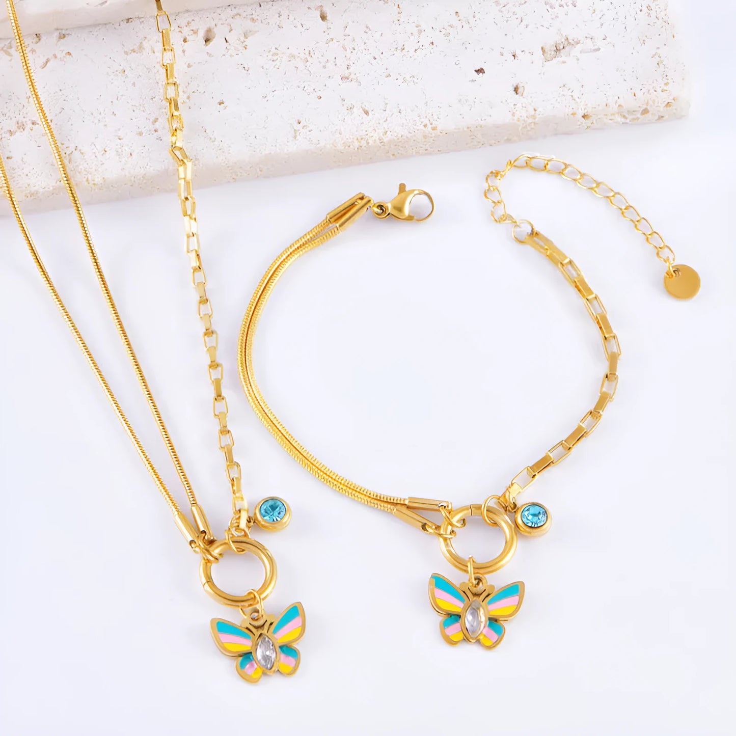 Gold-coloured titanium steel butterfly necklace and matching bracelet set on a snake bone chain.