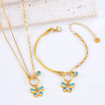 Gold-coloured titanium steel butterfly necklace and matching bracelet set on a snake bone chain.