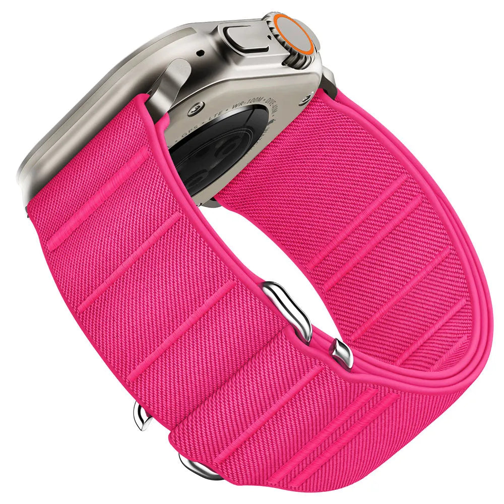 Elastic nylon Apple Watch band with stainless steel buckle shown in Army Green colour on a wrist.