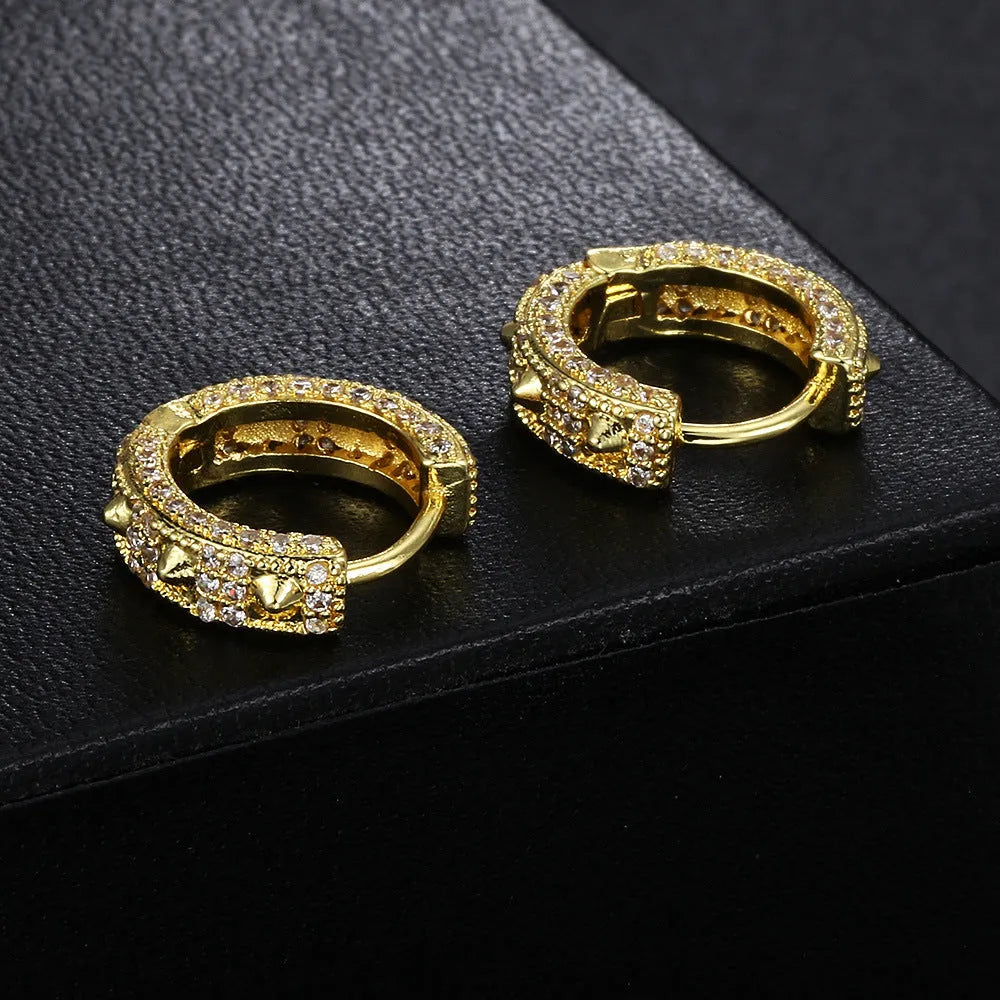 Geometric round hip hop ear clips in white gold stone colour on copper, shown as a pair.