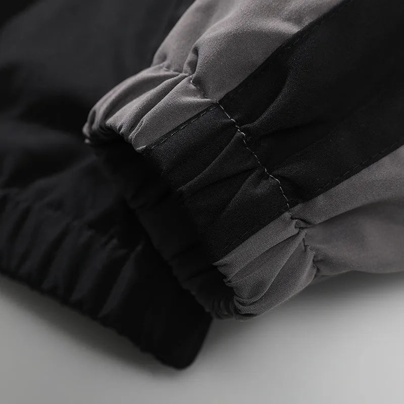 Men's black casual jacket with contrast stitching detail and side pockets for outdoor wear