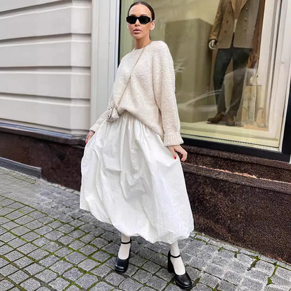 Women's long solid-colour cotton skirt shown in black and white.